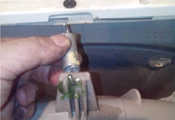 unhook the spring