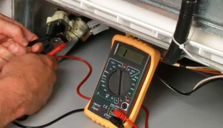 checking the dishwasher heating element with a multimeter